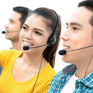 Two men and a woman smiling as they answer calls.